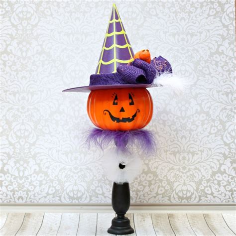 Glowing pumpkin with witch hat